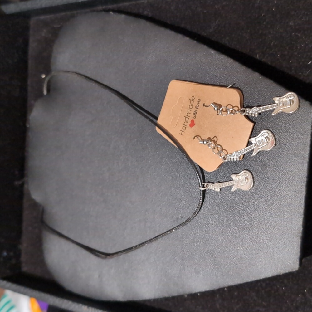 Black and silverl guitar dangle earrings and silver-tone electric guitar pendant